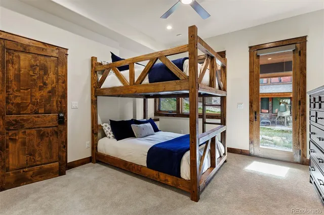 a bathroom with double sink and a shower