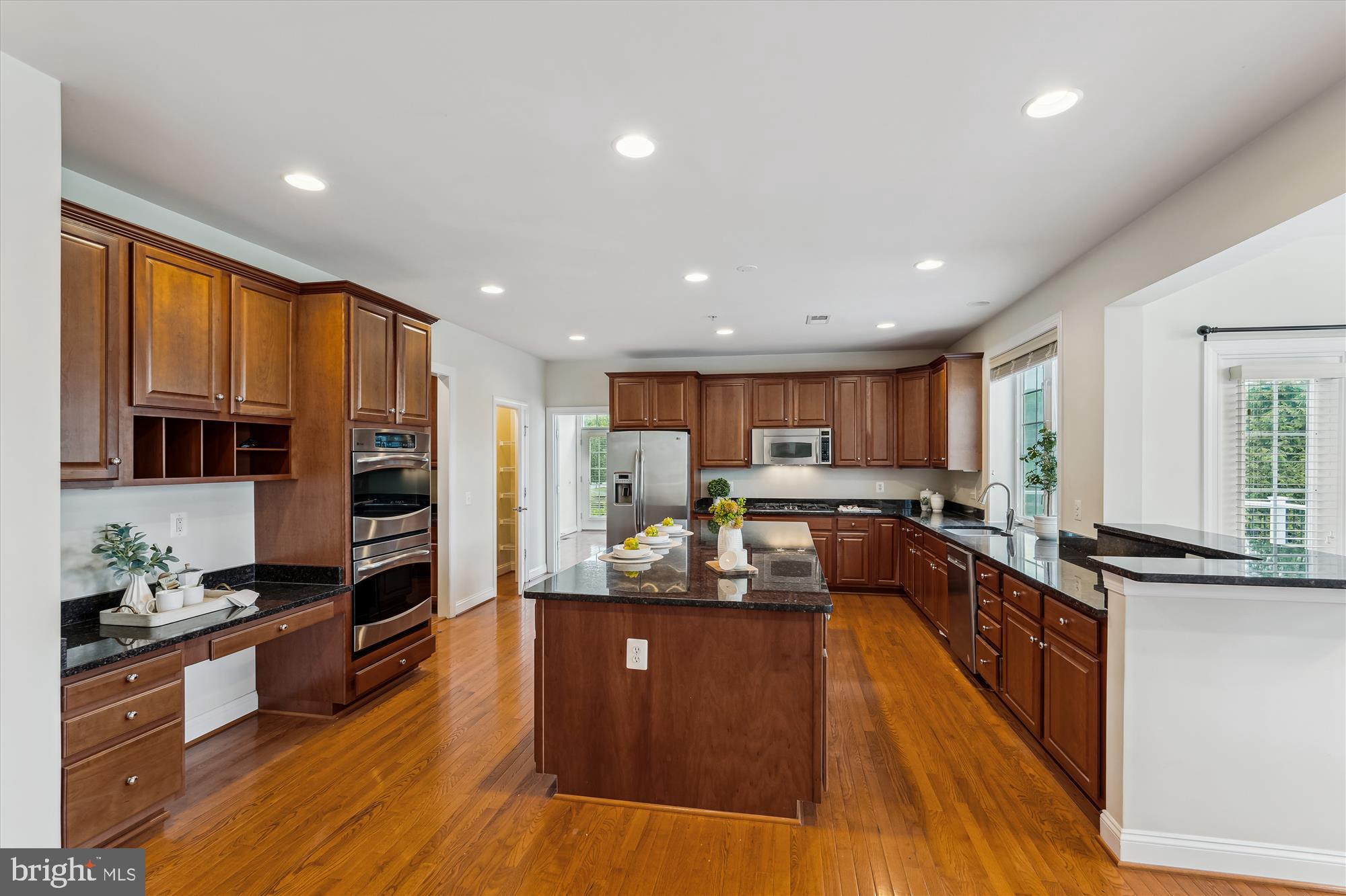 4806 Fair Hill Road Olney, MD 20832 - Photo 22 of 77 a large kitchen with stainless steel appliances lots of counter space and a window