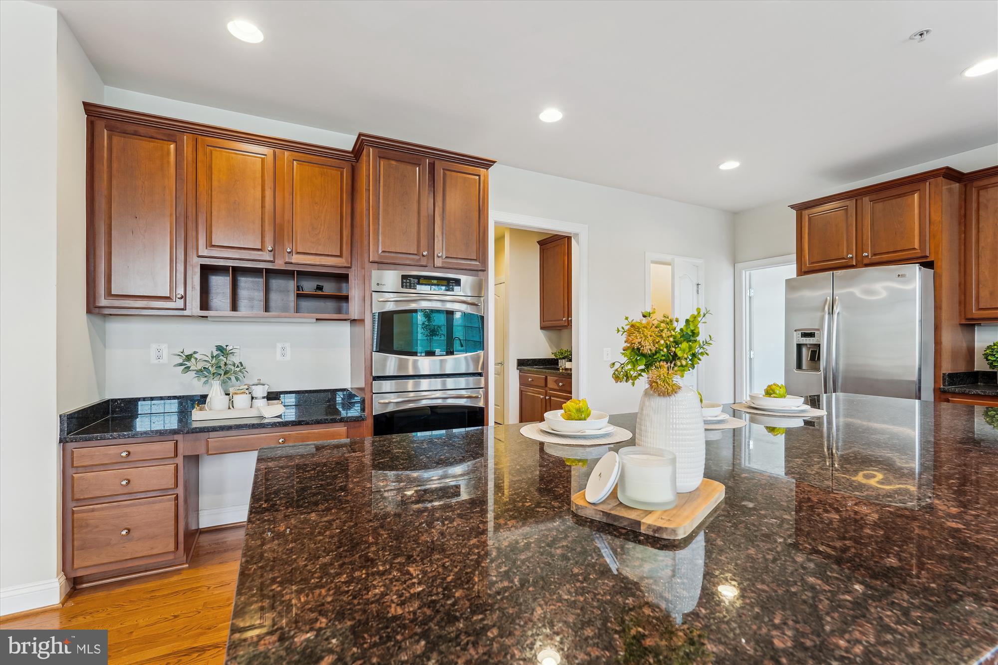 4806 Fair Hill Road Olney, MD 20832 - Photo 24 of 77 a kitchen with granite countertop a refrigerator and a sink