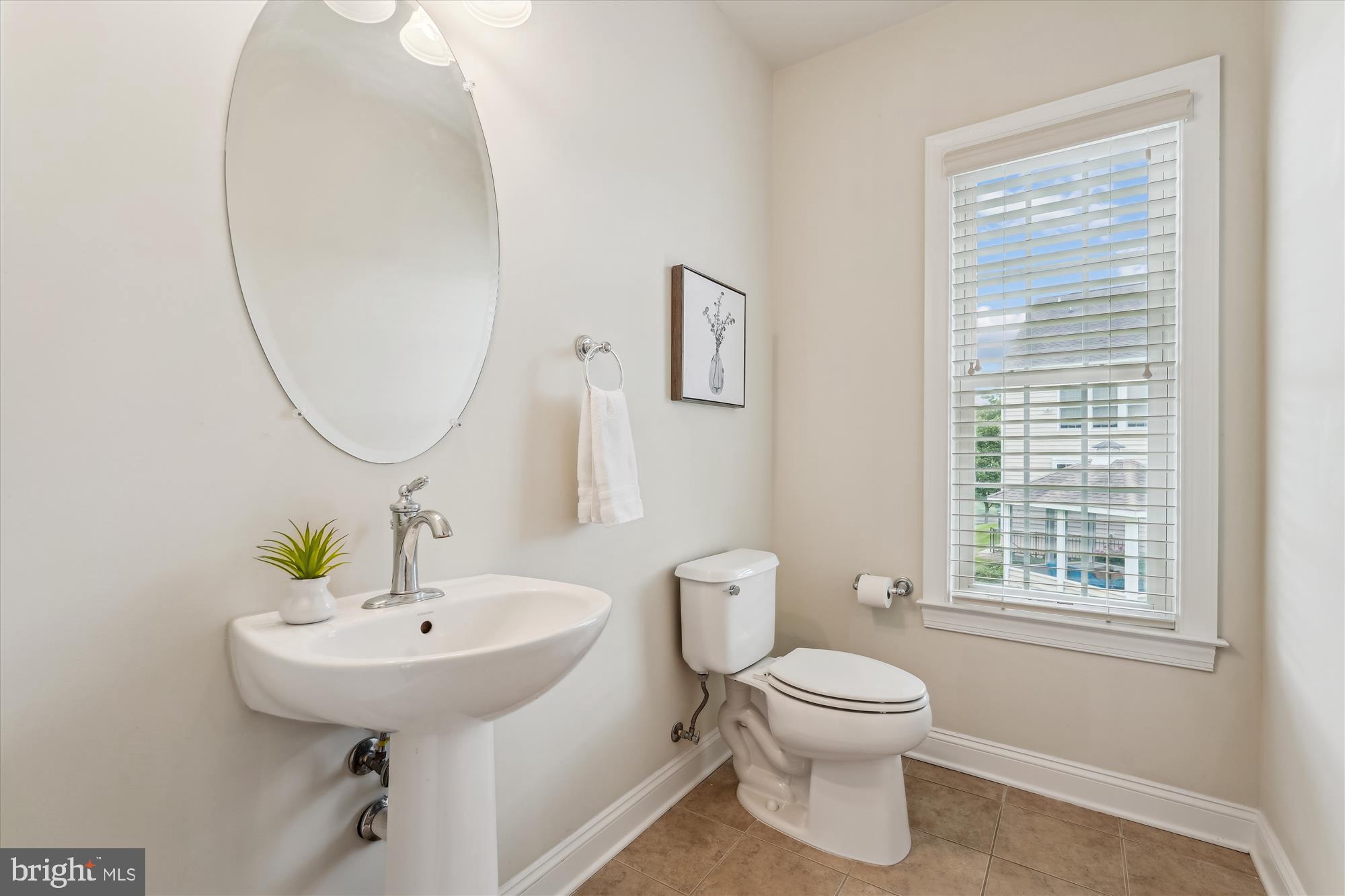4806 Fair Hill Road Olney, MD 20832 - Photo 37 of 77 a bathroom with a toilet sink and mirror