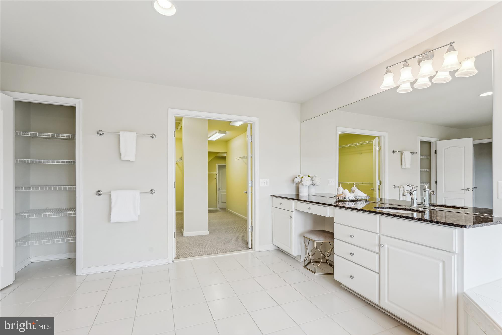 4806 Fair Hill Road Olney, MD 20832 - Photo 49 of 77 a bathroom with a granite countertop sink mirror and a
