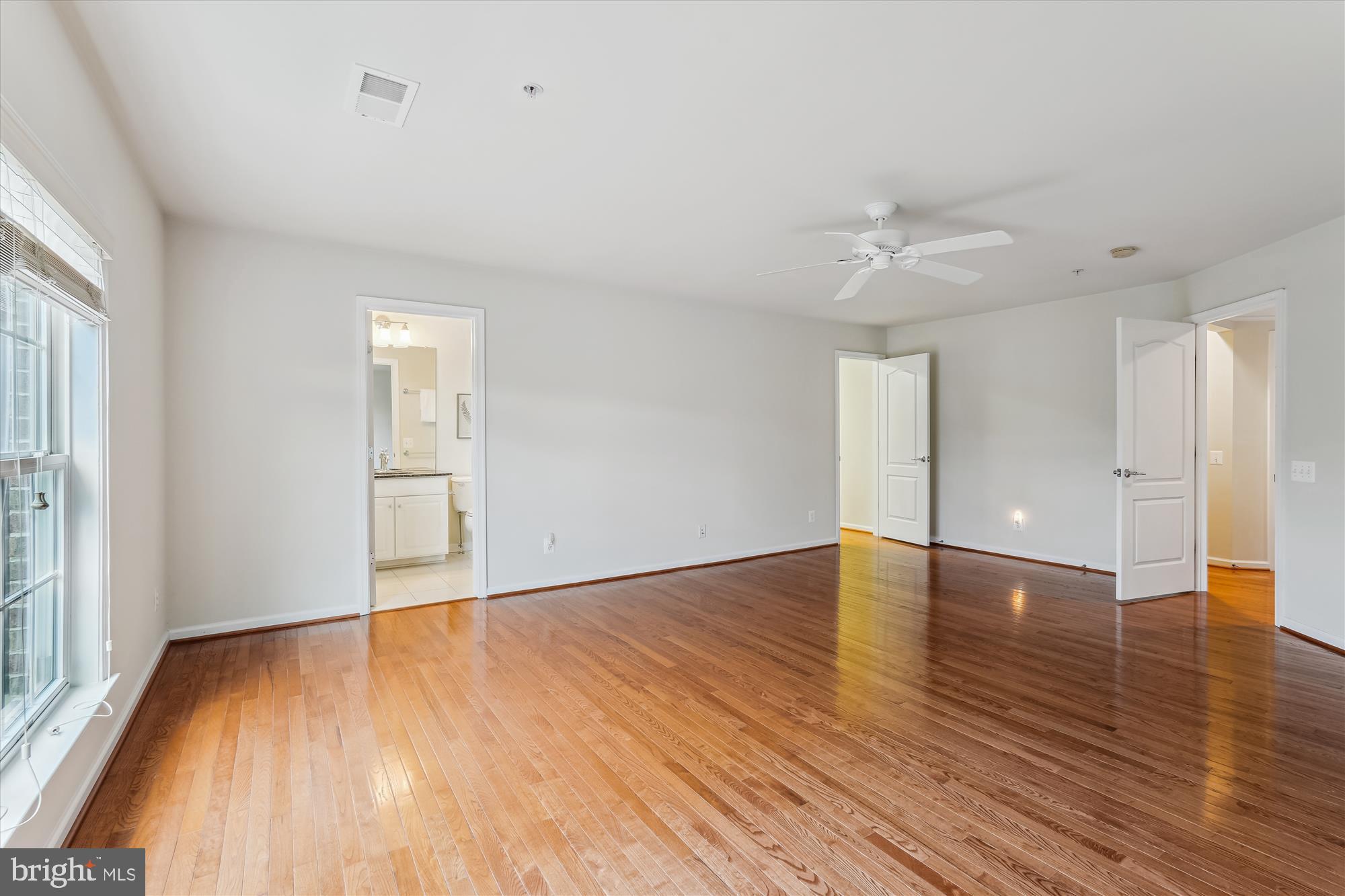 4806 Fair Hill Road Olney, MD 20832 - Photo 54 of 77 a view of an empty room with wooden floor and a window