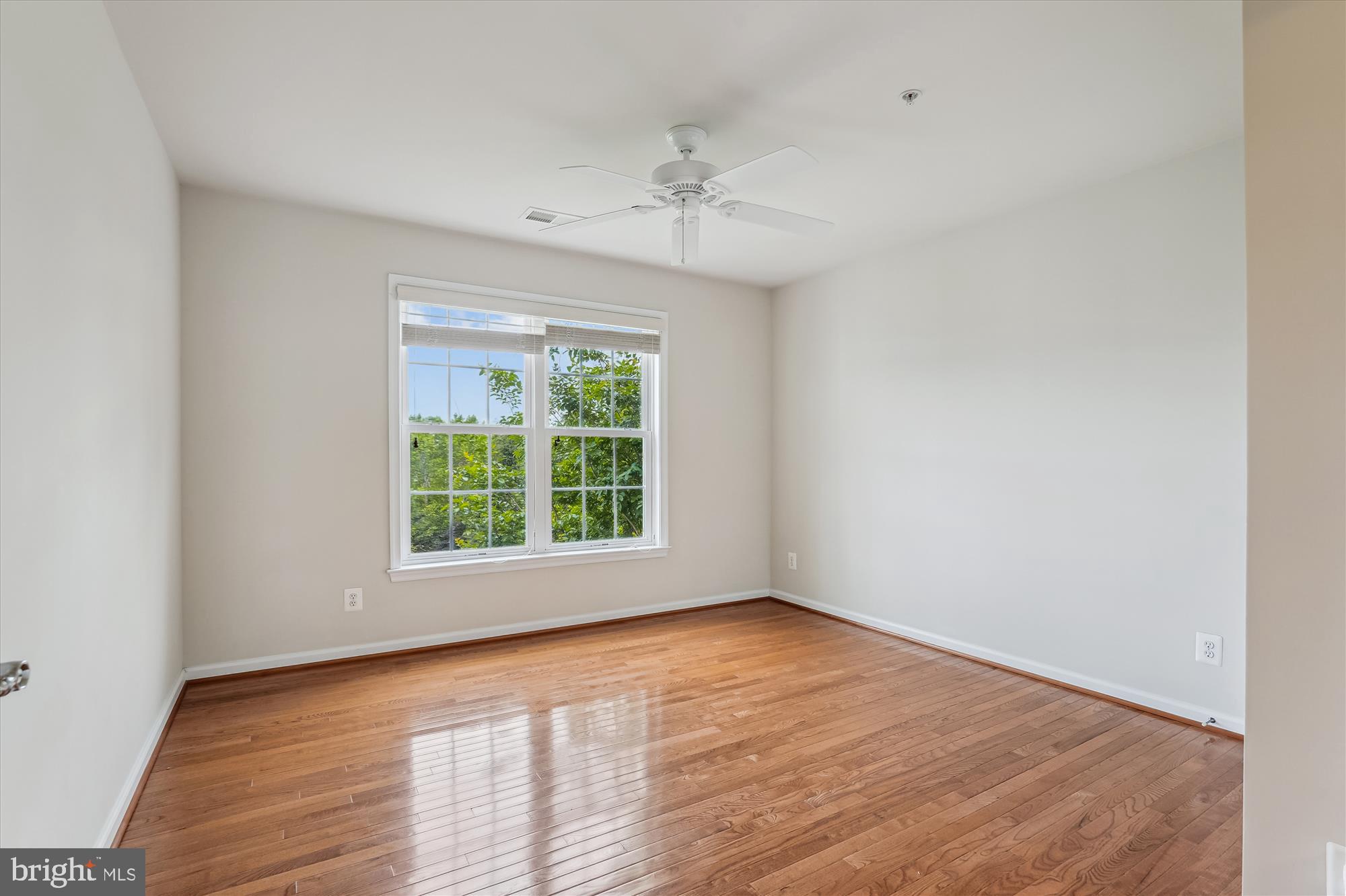 4806 Fair Hill Road Olney, MD 20832 - Photo 59 of 77 wooden floor in an empty room with a window