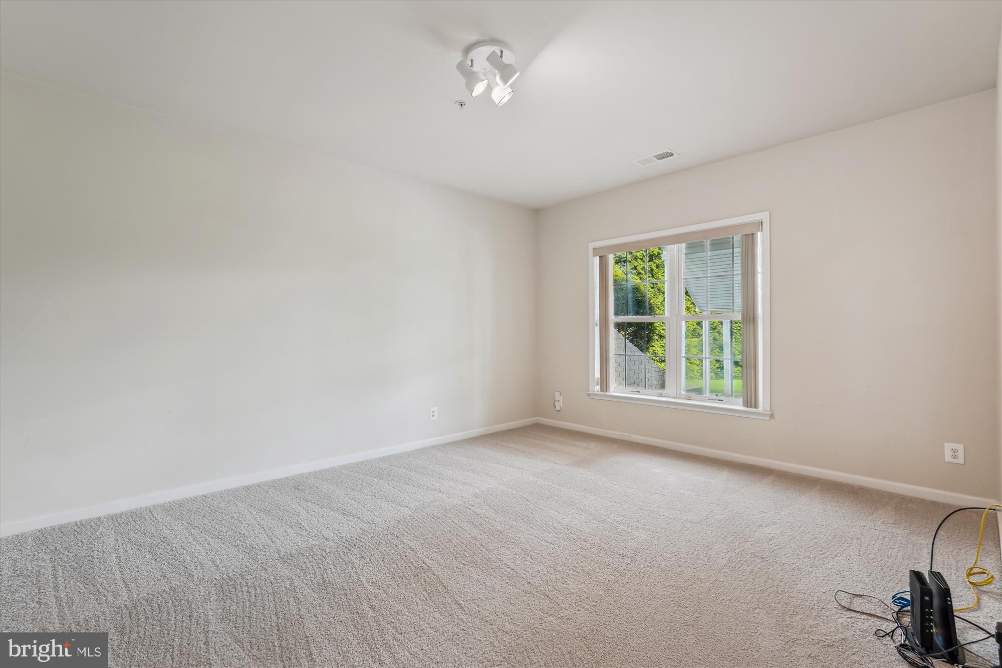 4806 Fair Hill Road Olney, MD 20832 - Photo 69 of 77 wooden floor in an empty room with a window