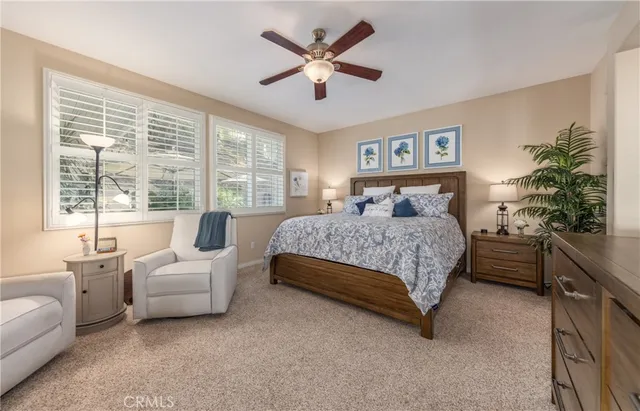 a bedroom with a large bed and a couch