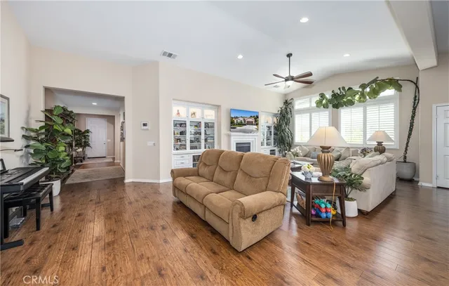 a living room with furniture and a large window