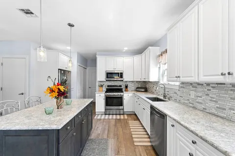 $1,850,000 | 133 Malloy Drive, East Quogue, NY 11942