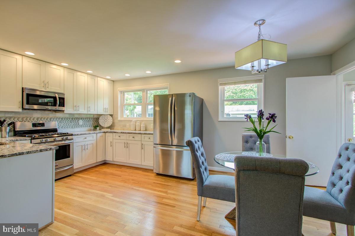 11206 Rock Road Rockville, MD 20852 - Photo 9 of 37 Sunfilled kitchen and dining areas.
