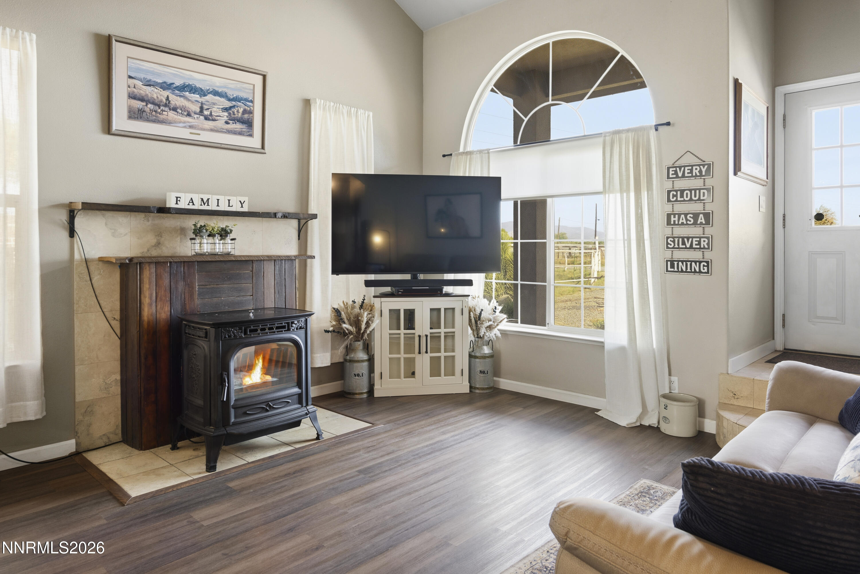 765 Stock Lane Fernley, NV 89408 - Photo 13 of 34 a living room with furniture and a flat screen tv