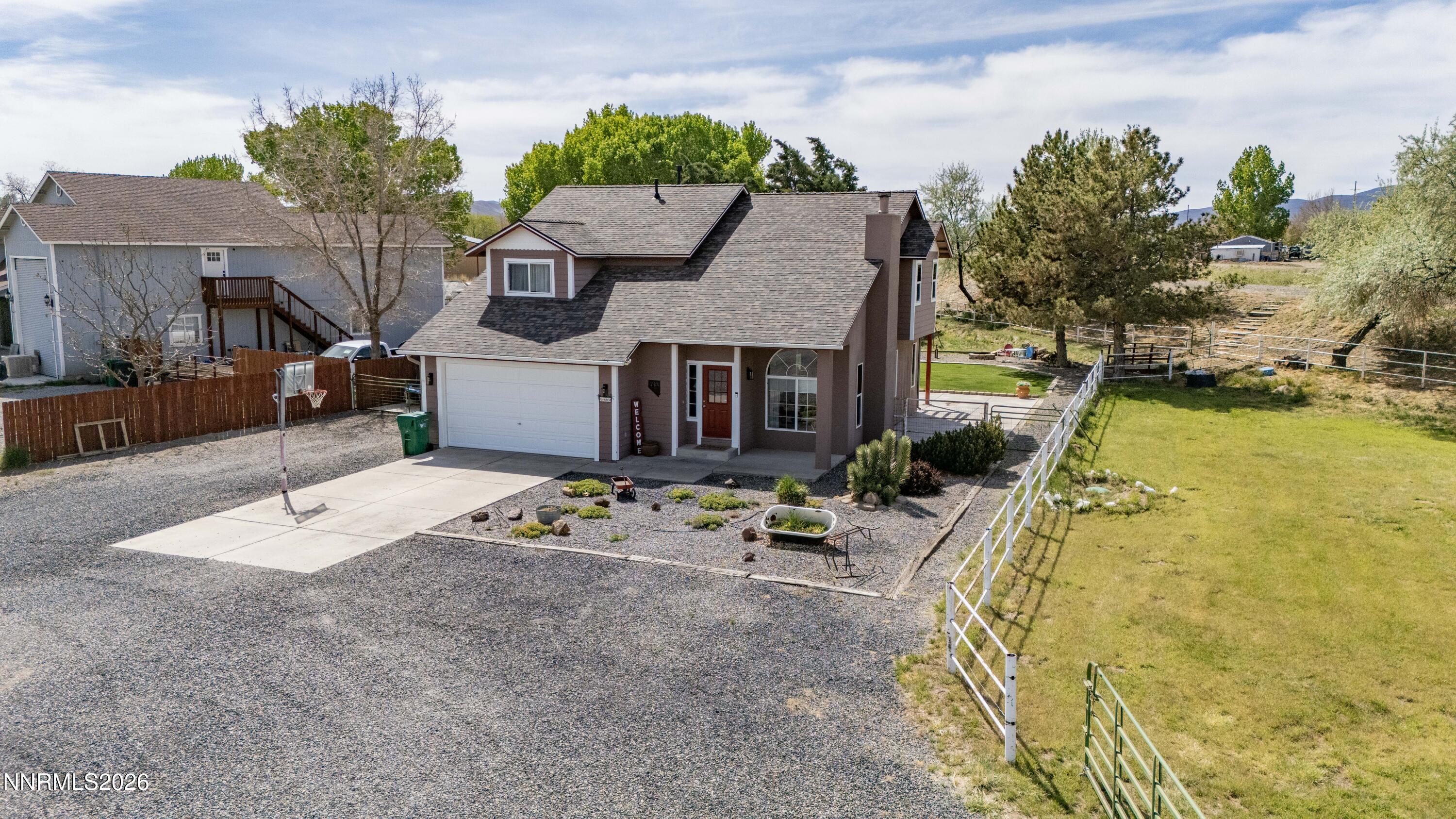 765 Stock Lane Fernley, NV 89408 - Photo 2 of 34 a view of a house with swimming pool