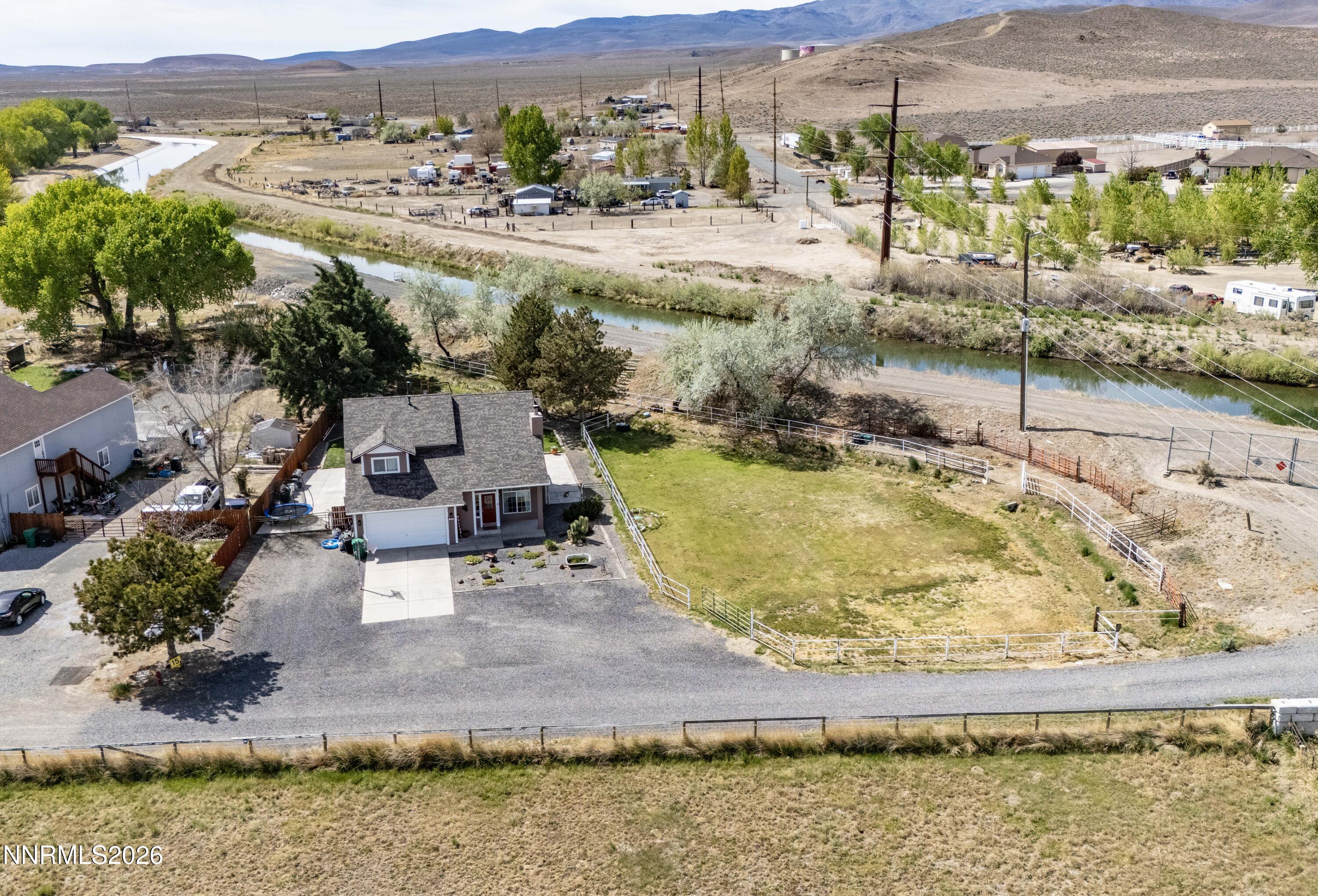 765 Stock Lane Fernley, NV 89408 - Photo 10 of 34 an aerial view of residential houses with outdoor space