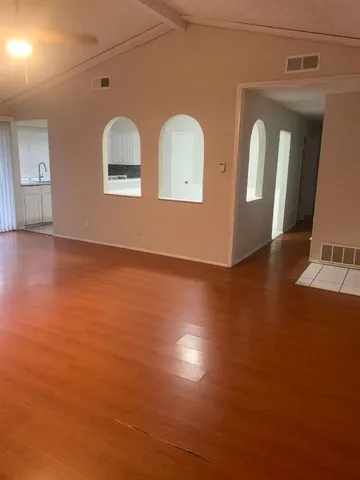 a view of a livingroom with wooden floor