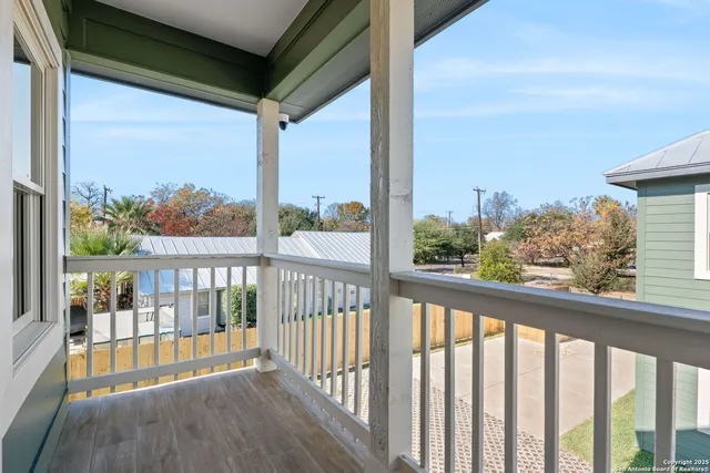 a view of a porch with a floor to ceiling window