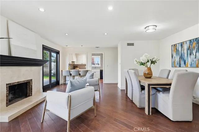 a living room with furniture a fireplace and a table