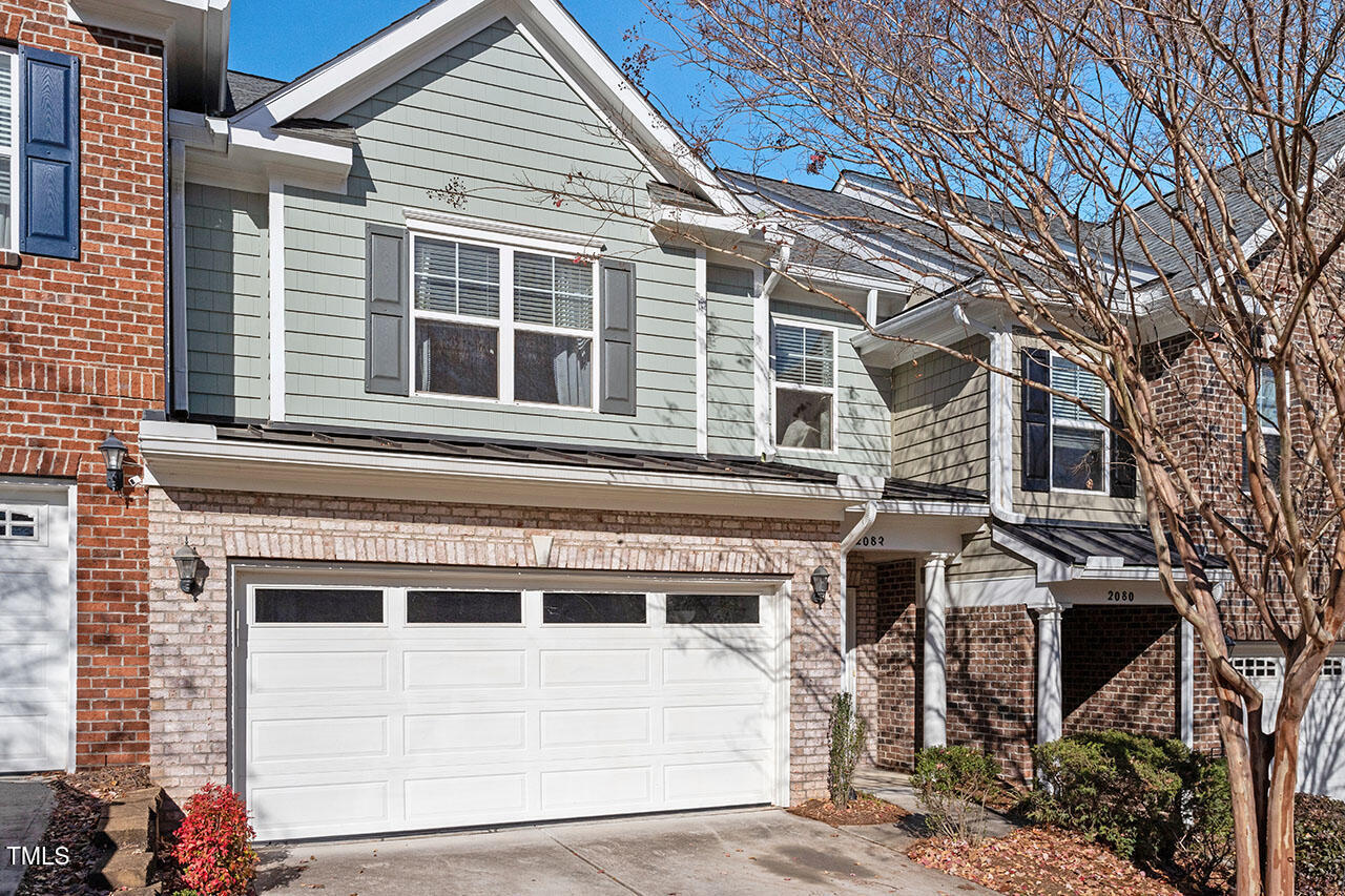 a front view of a house with a garage