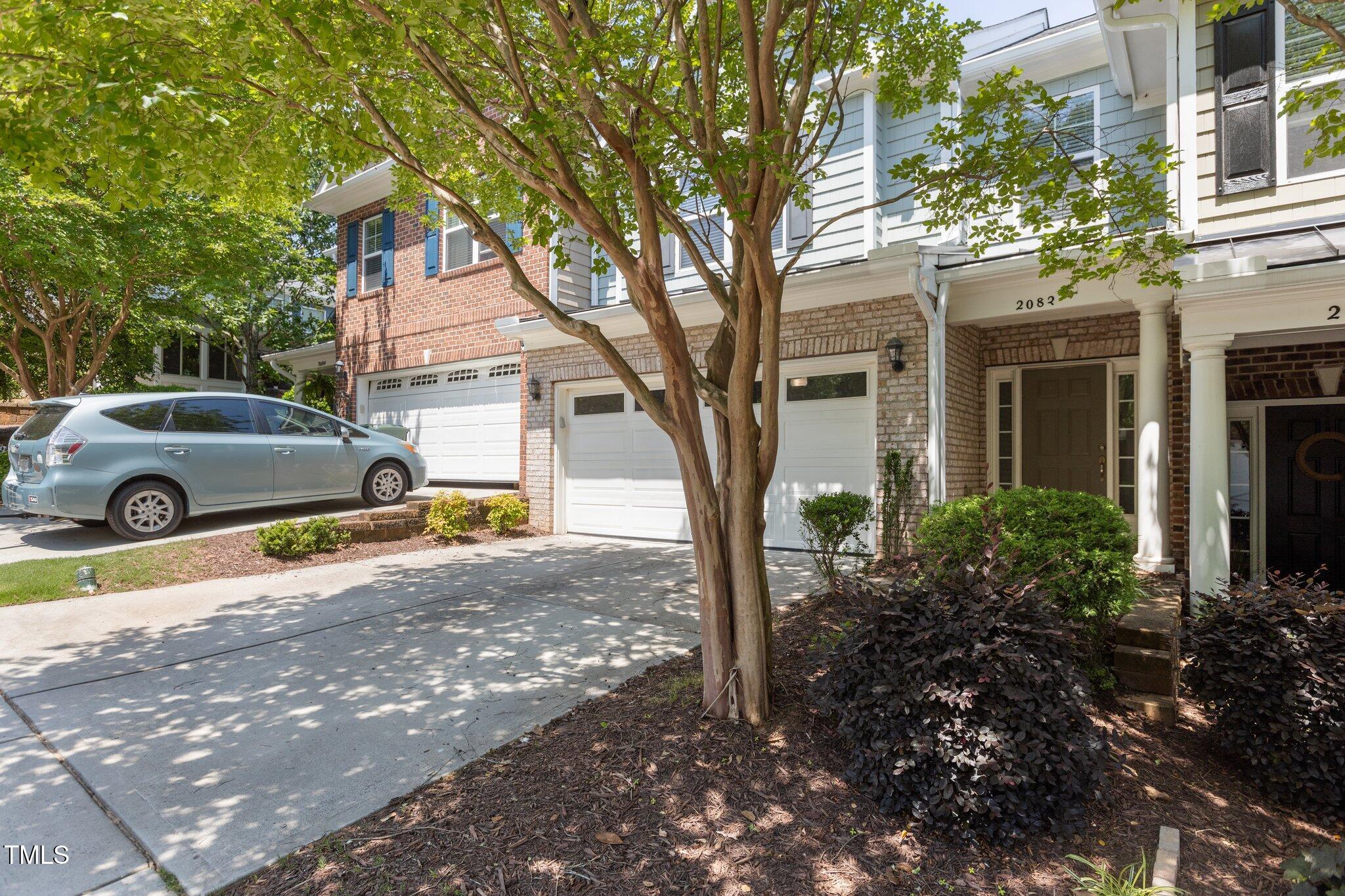 2082 Weston Green Loop Cary, NC 27513 - Photo 3 of 49 a house view with a outdoor space