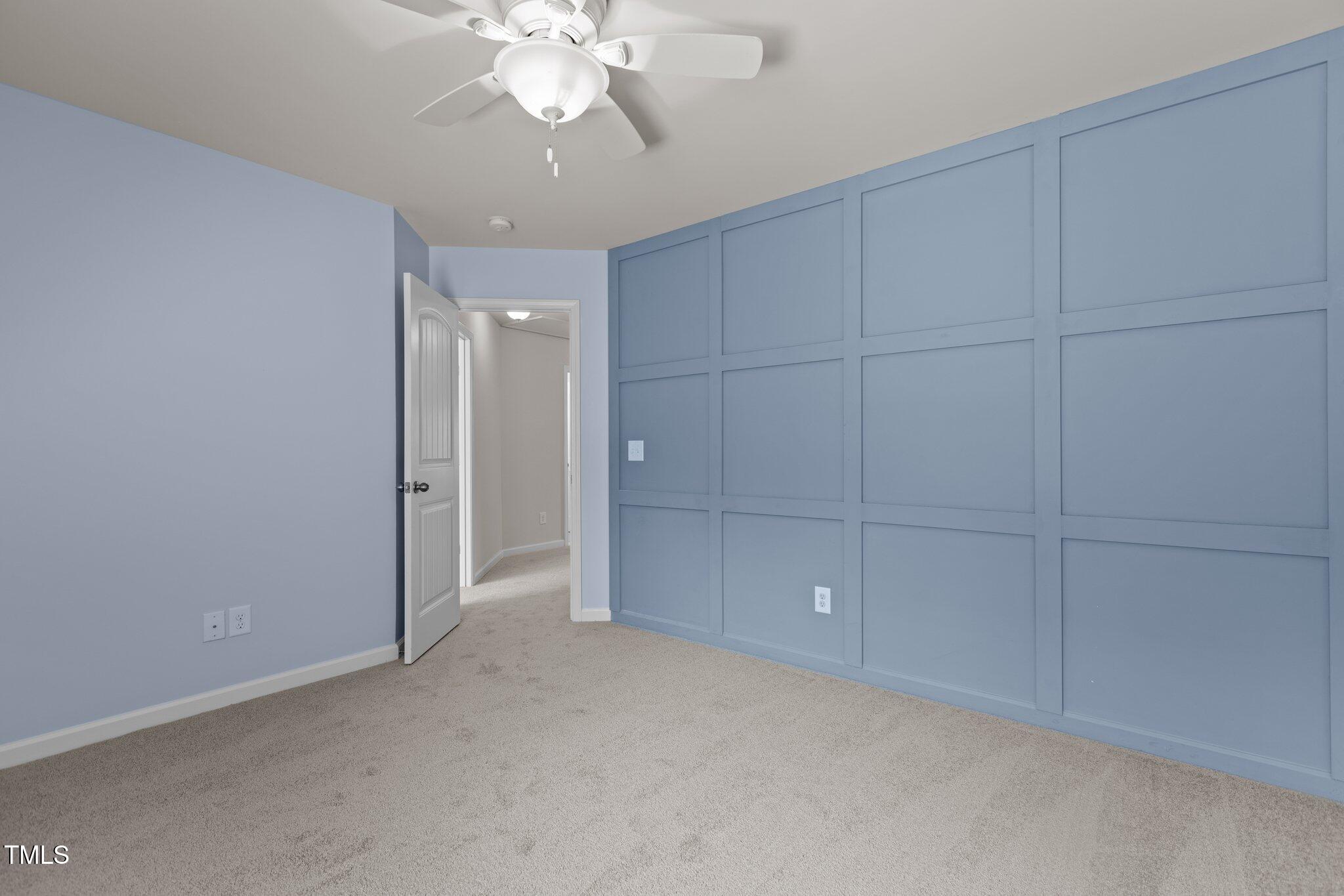 2082 Weston Green Loop Cary, NC 27513 - Photo 40 of 49 an empty room with chandelier fan