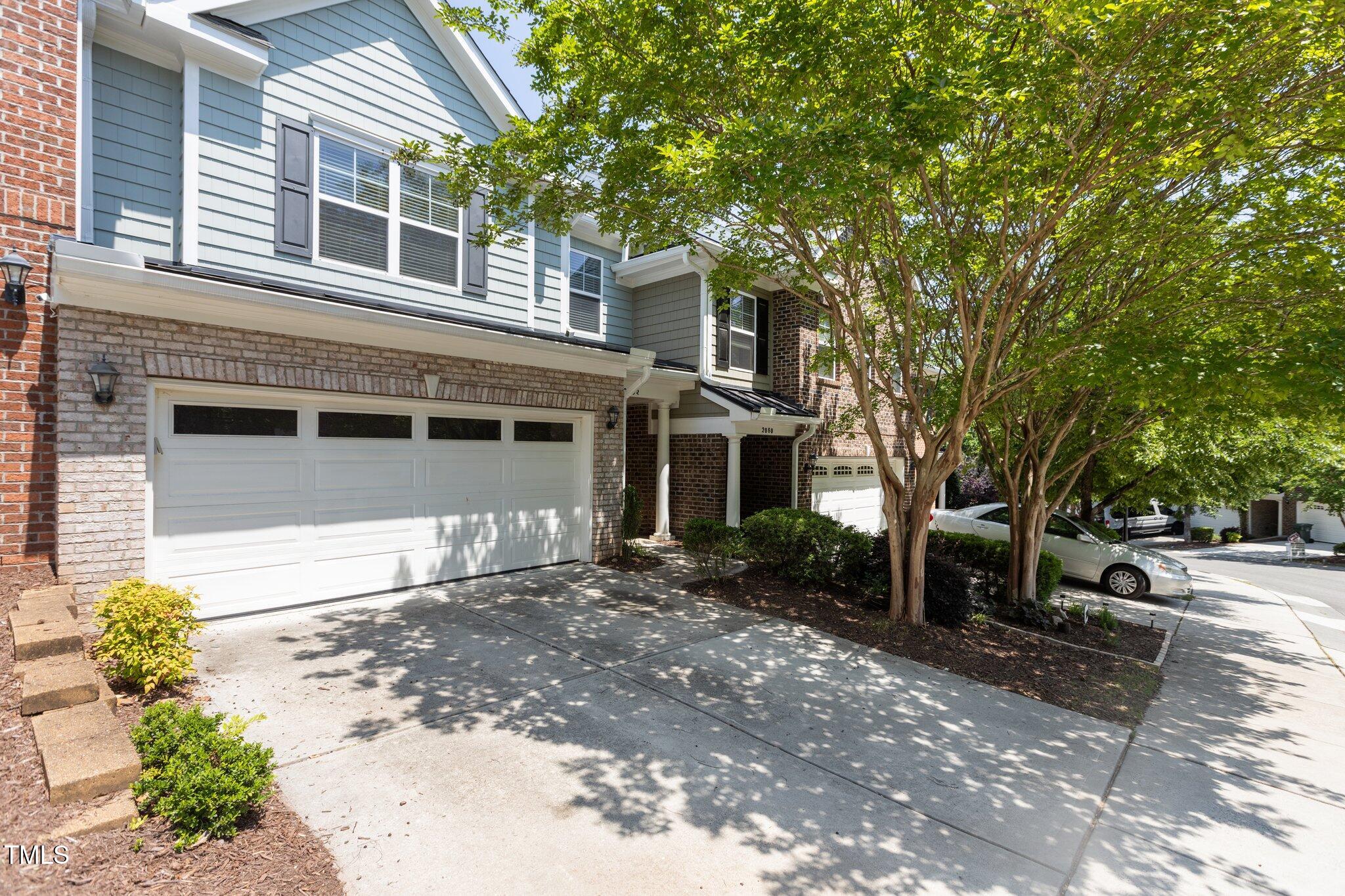 2082 Weston Green Loop Cary, NC 27513 - Photo 4 of 49 a front view of a house with a yard