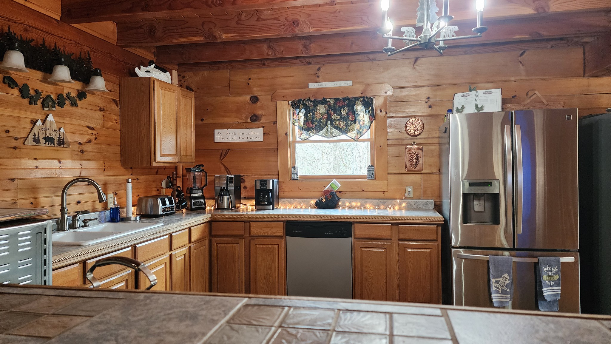 5615 Eastport Road Alpine, TN 38543 - Photo 30 of 83 a kitchen with stainless steel appliances granite countertop a sink stove and refrigerator