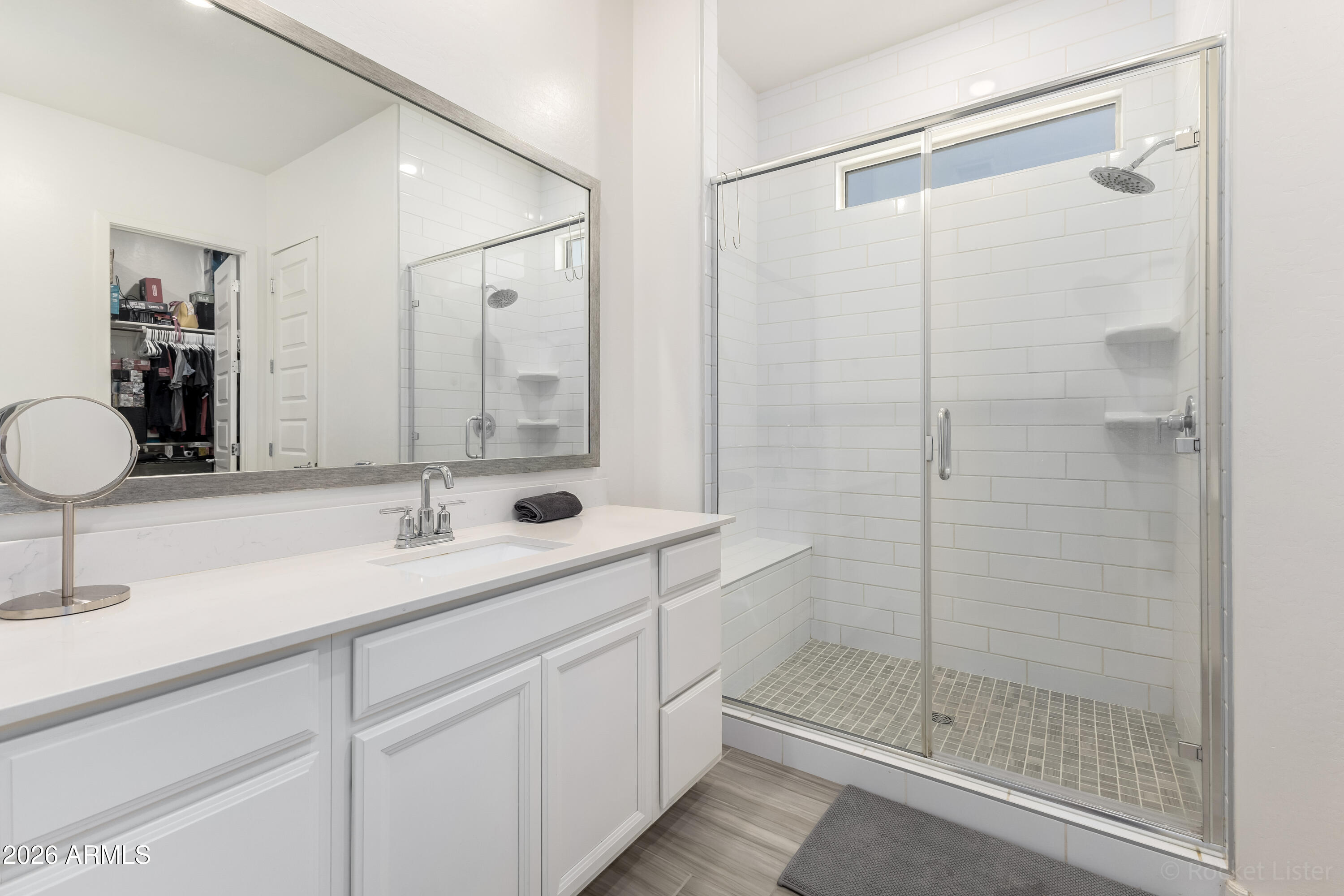 23929 North 166th Lane Surprise, AZ 85387 - Photo 11 of 23 a bathroom with a shower sink and mirror
