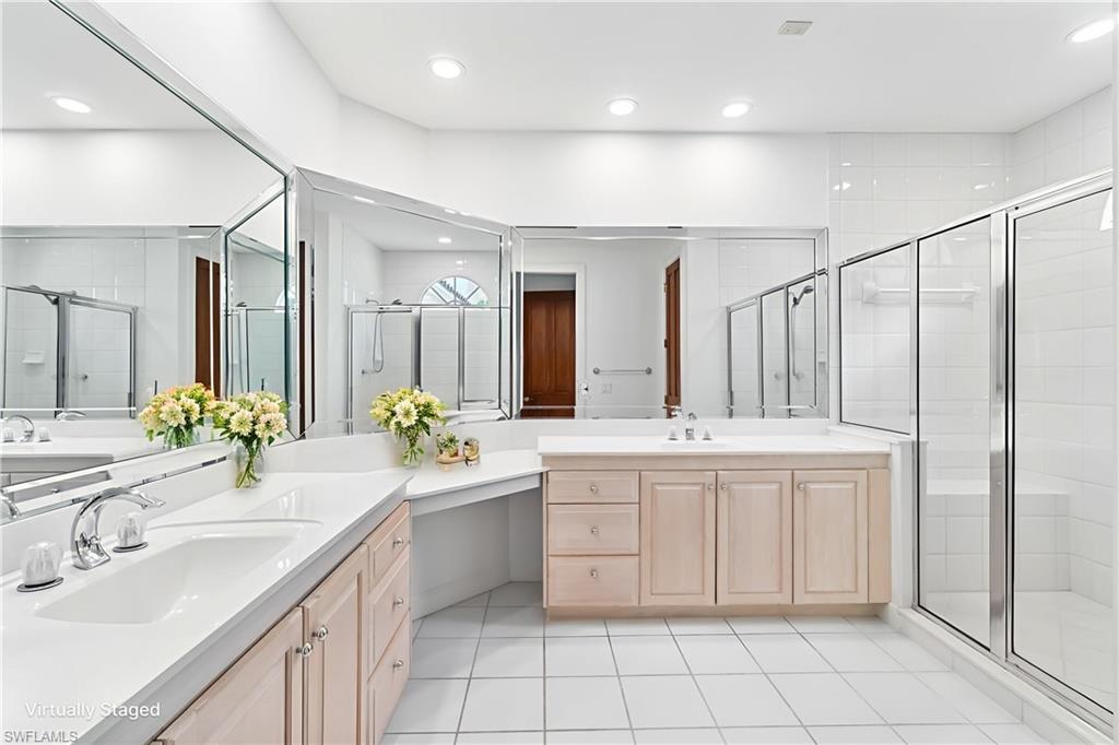 8169 Via Vecchia Naples, FL 34108 - Photo 14 of 33 a bathroom with a granite countertop sink mirror and double