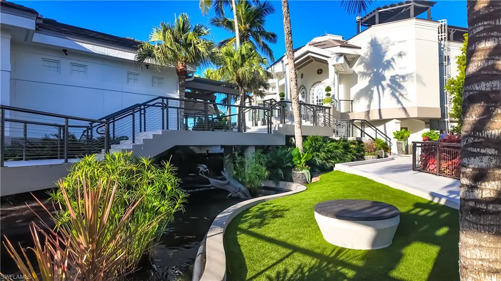8169 Via Vecchia Naples, FL 34108 - Photo 20 of 33 a view of yard with outdoor seating