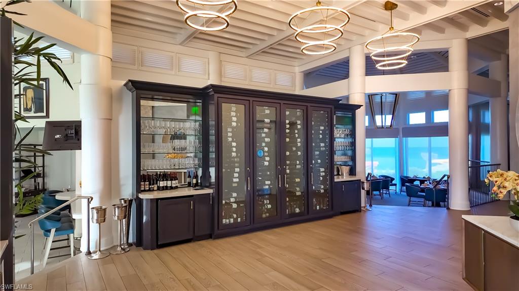 8169 Via Vecchia Naples, FL 34108 - Photo 24 of 33 a view of a building with entryway and wooden floor