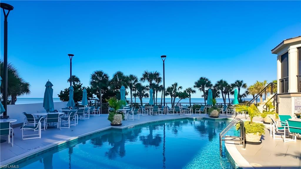8169 Via Vecchia Naples, FL 34108 - Photo 26 of 33 a view of a swimming pool with a patio