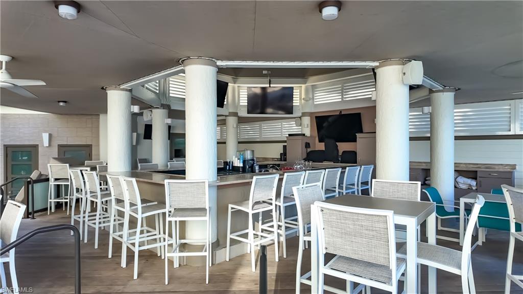 8169 Via Vecchia Naples, FL 34108 - Photo 27 of 33 a dinning area with furniture and view of kitchen