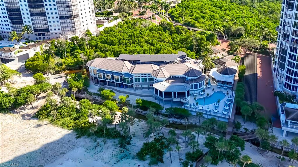 8169 Via Vecchia Naples, FL 34108 - Photo 29 of 33 a view of a patio with plants and large trees