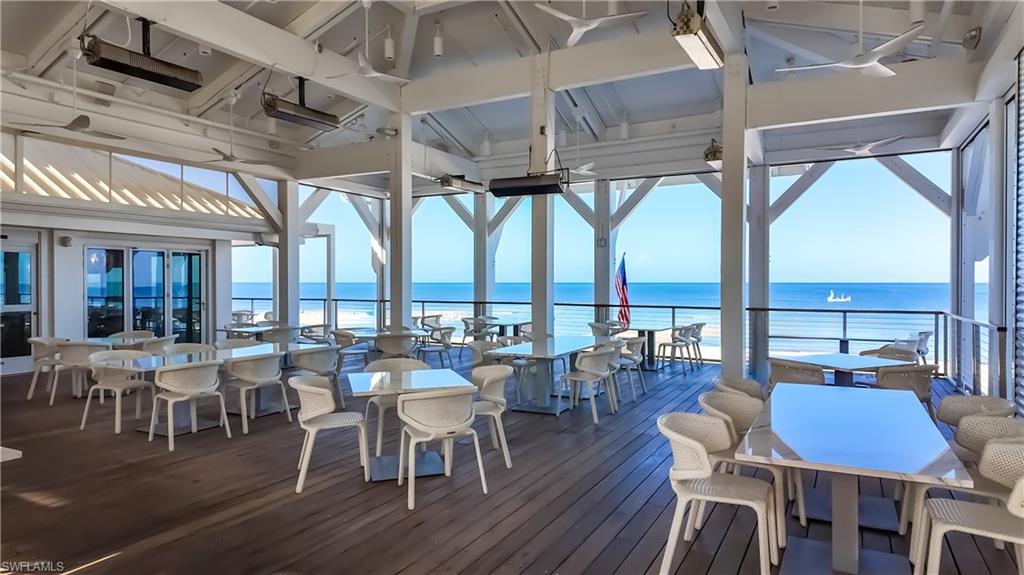 8169 Via Vecchia Naples, FL 34108 - Photo 32 of 33 a view of a dining room with furniture window and wooden floor