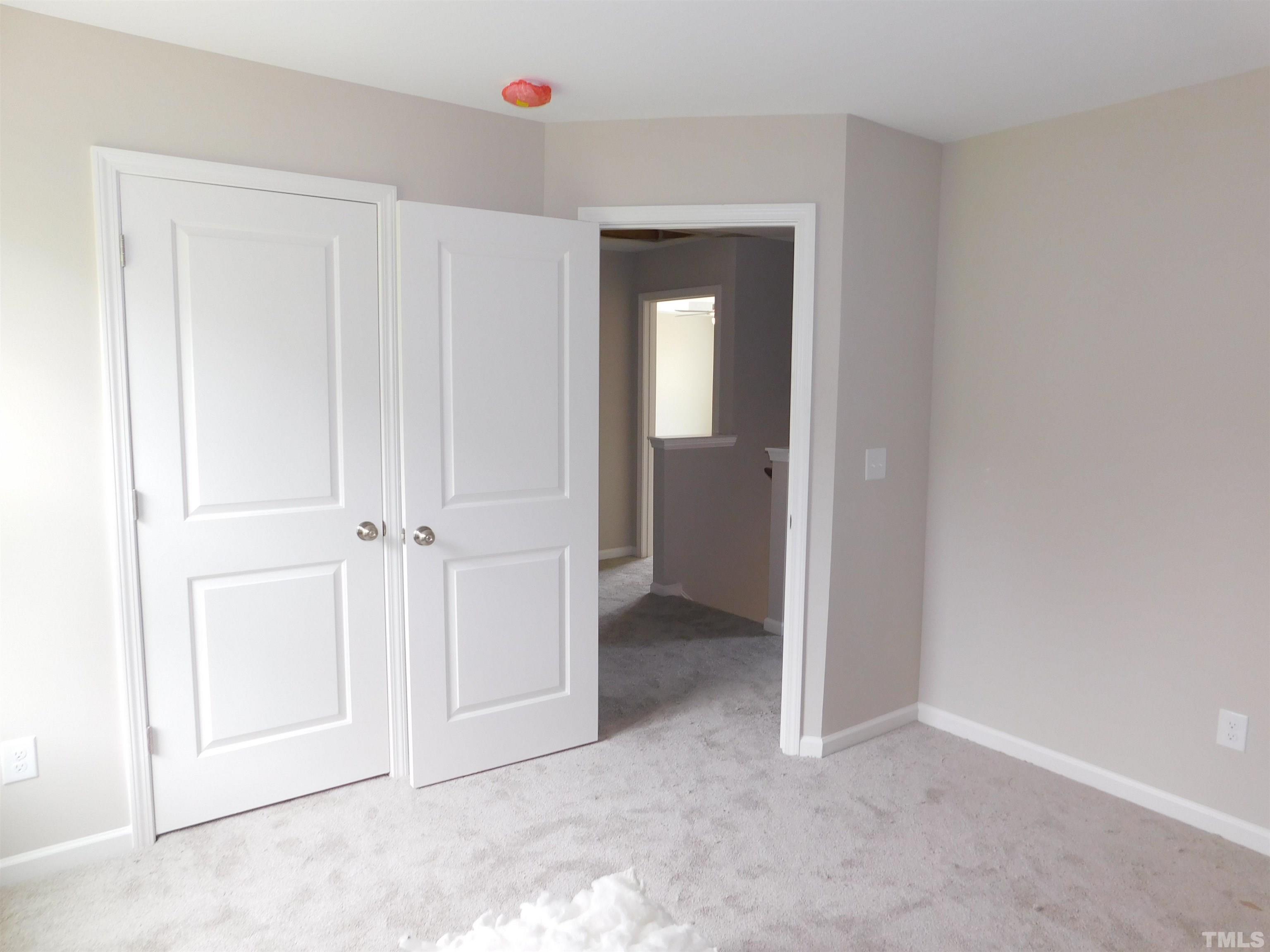 84 Kickoff Circle Benson, NC 27504 - Photo 14 of 21 an empty room with closet area