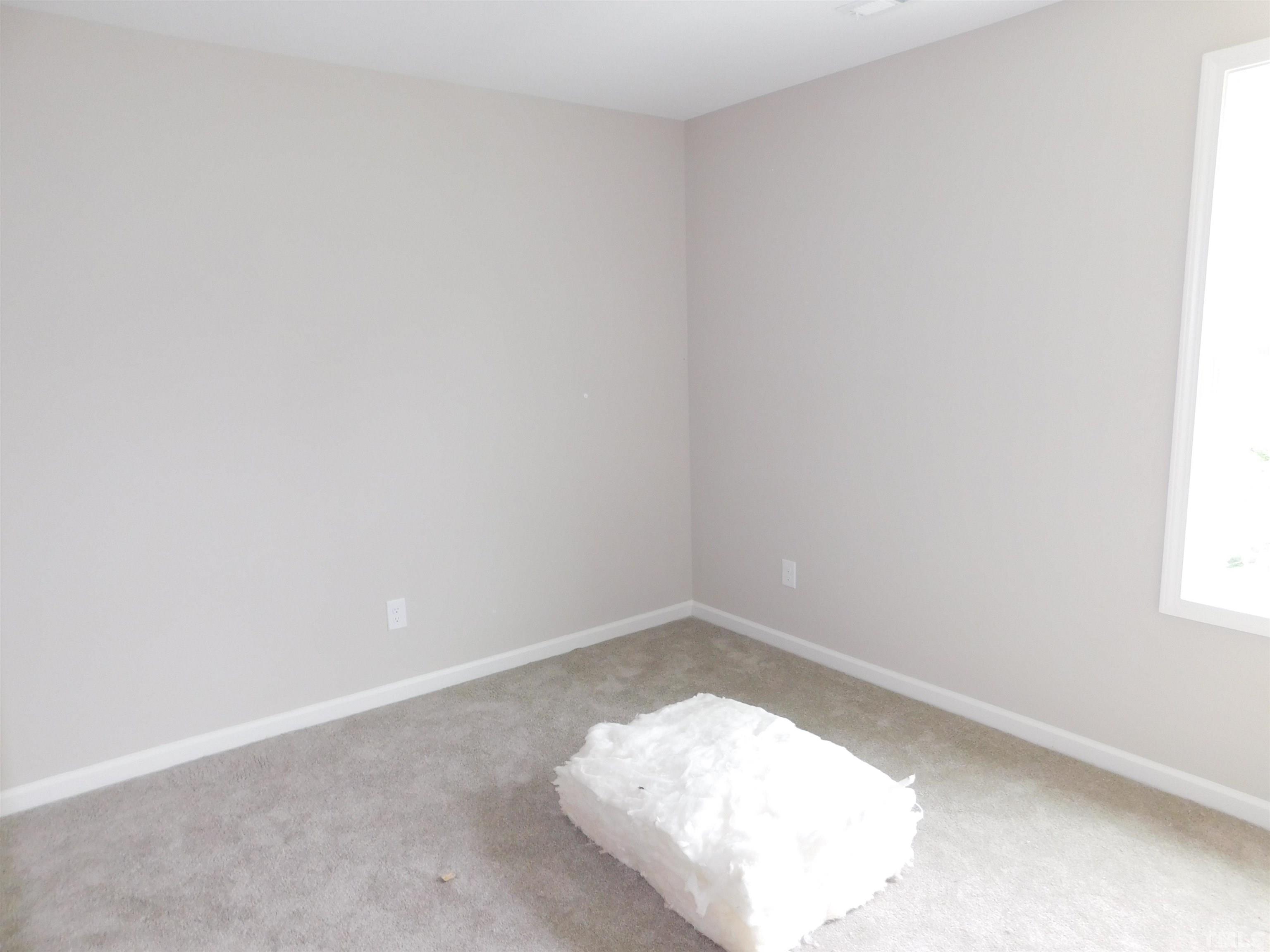 84 Kickoff Circle Benson, NC 27504 - Photo 15 of 21 an empty room with a window