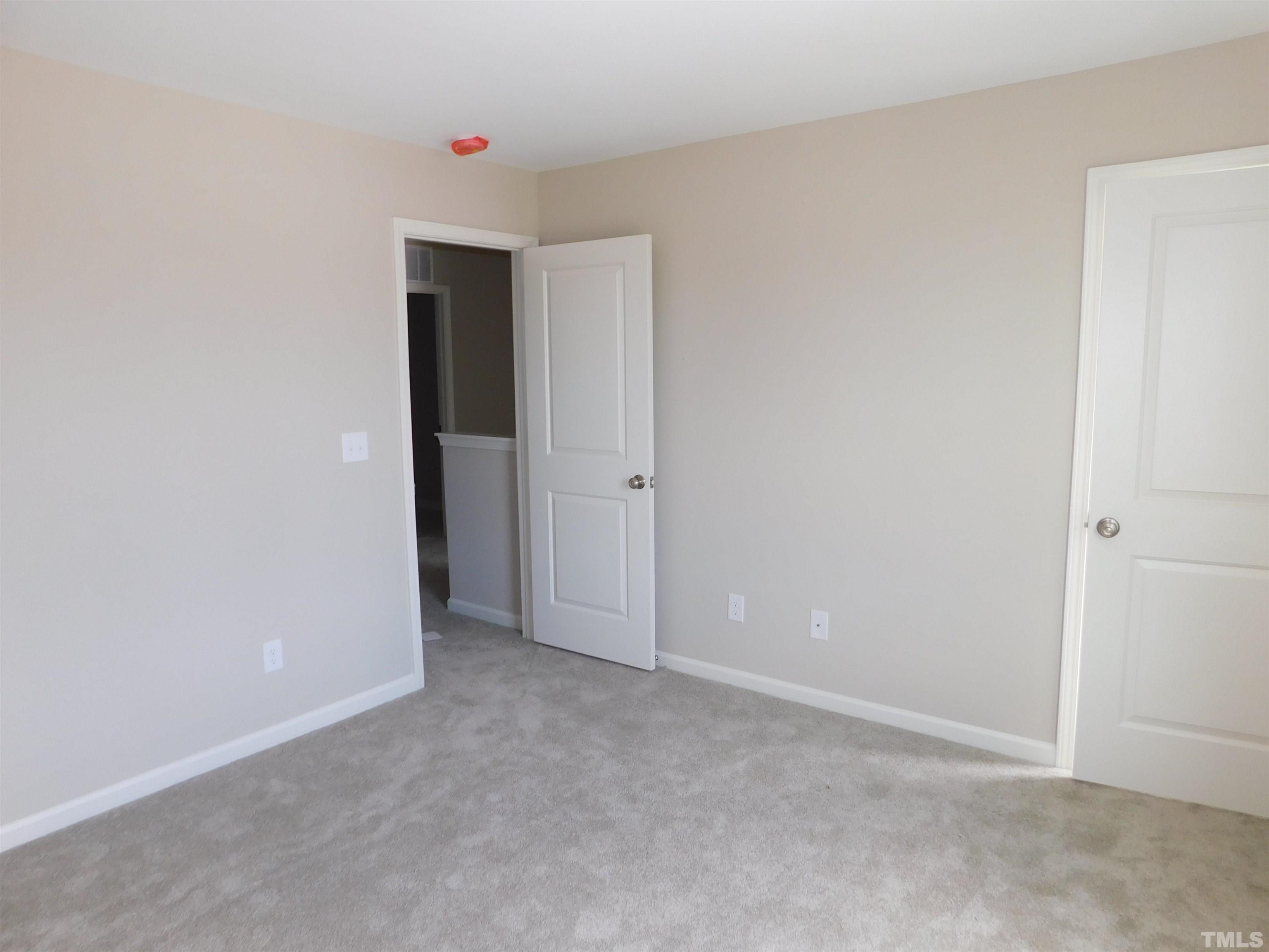 84 Kickoff Circle Benson, NC 27504 - Photo 16 of 21 a view of an empty room