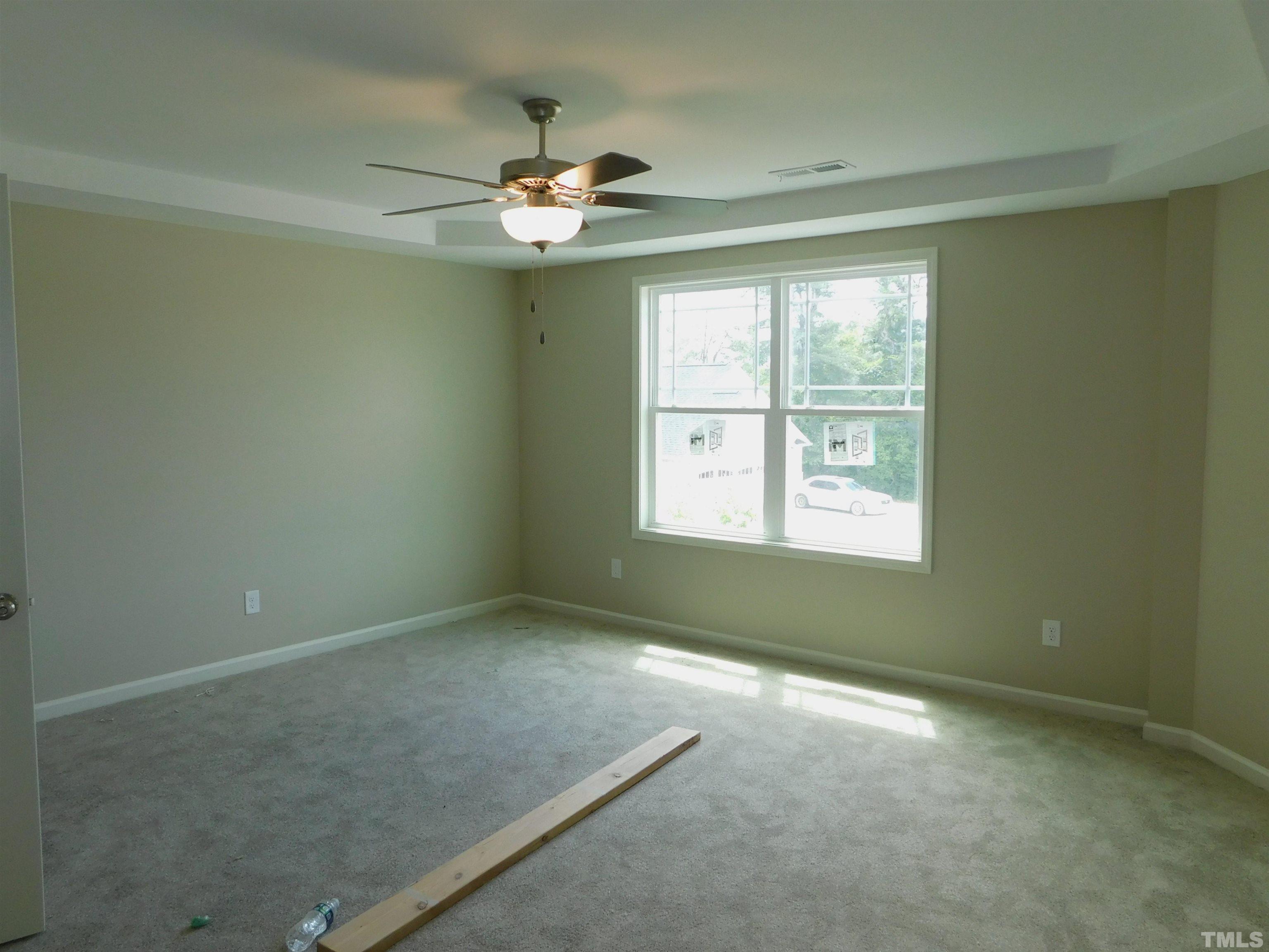 84 Kickoff Circle Benson, NC 27504 - Photo 10 of 21 an empty room with a window