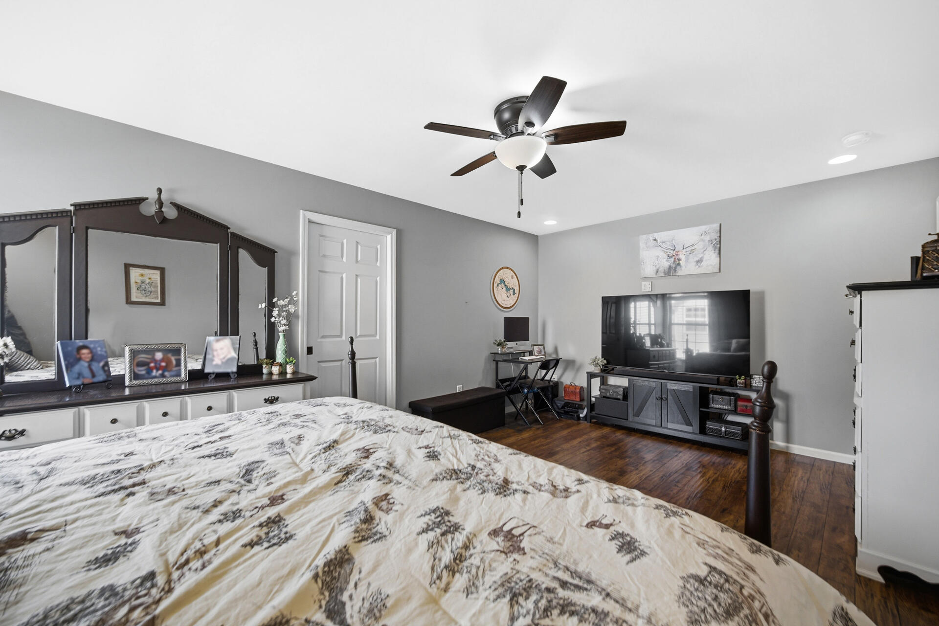 1913 Holly Street Southeast De Motte, IN 46310 - Photo 17 of 42 a bed room with a bed a flat tv screen and a dresser