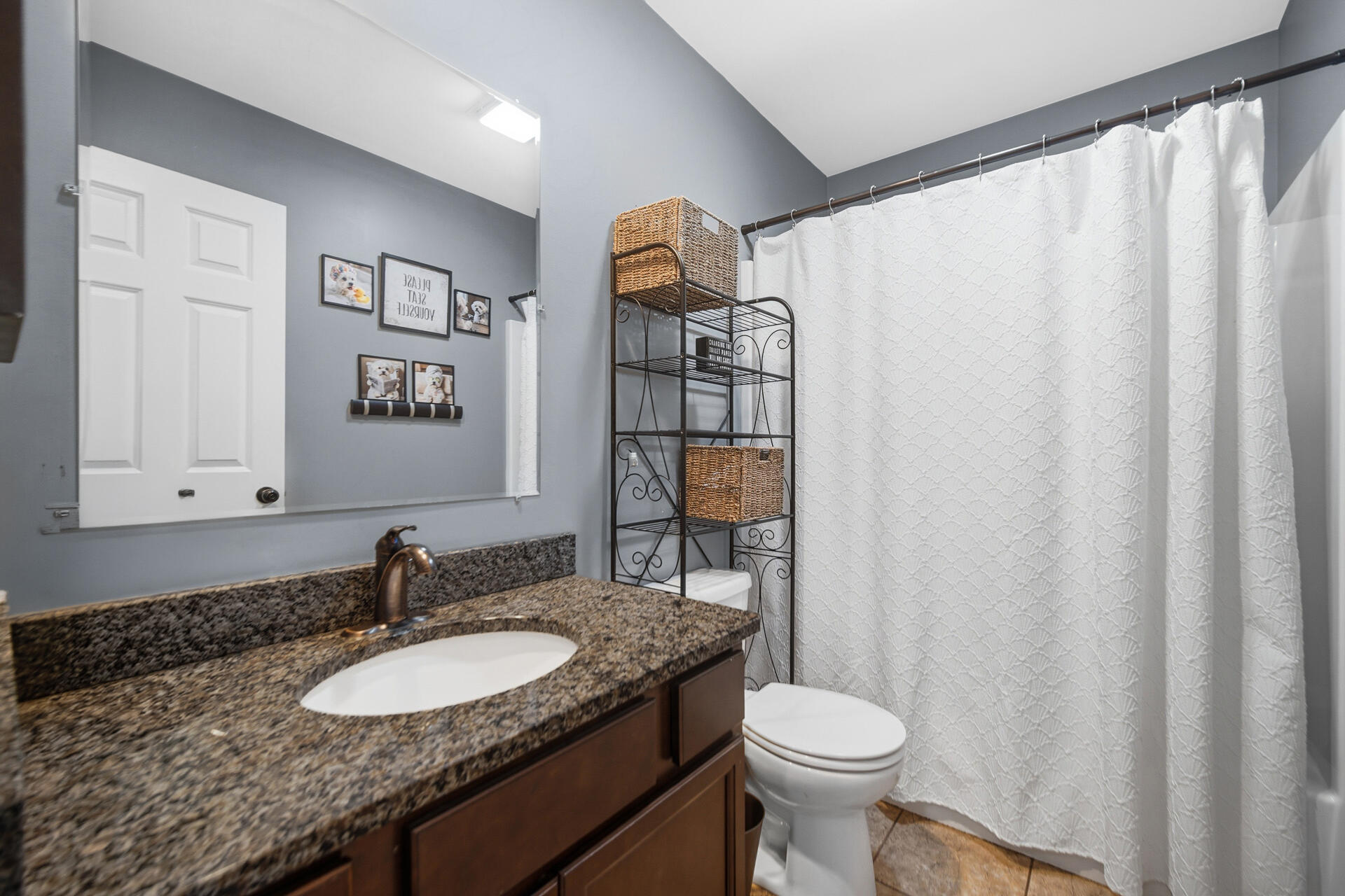 1913 Holly Street Southeast De Motte, IN 46310 - Photo 22 of 42 a bathroom with a granite countertop sink and a toilet