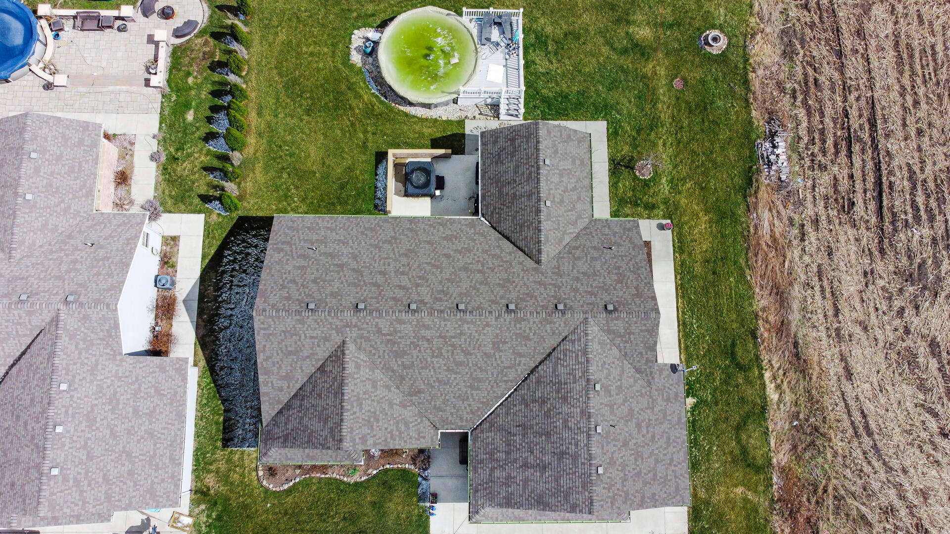 1913 Holly Street Southeast De Motte, IN 46310 - Photo 35 of 42 an aerial view of a house with garden space and swimming pool