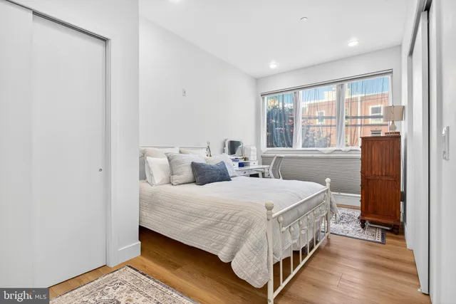 a bedroom with a bed and a table in it