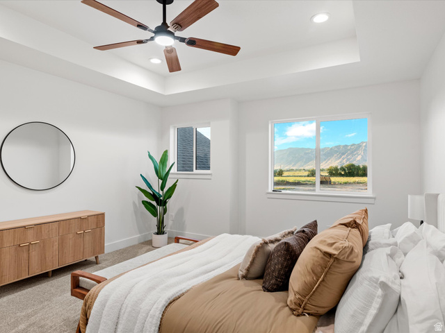 1267 West 2350 South Perry, UT 84302 - Photo 25 of 35 Room featuring a tray ceiling with recessed lighting and a ceiling fan