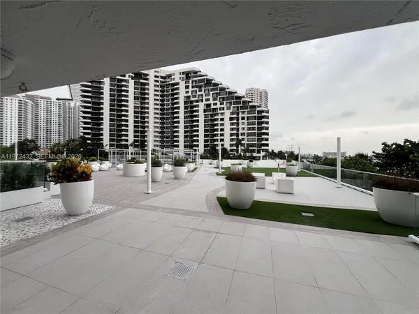 a large building with swimming pool in front of it