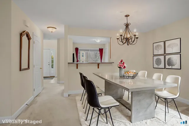 a view of a two chairs on the roof deck