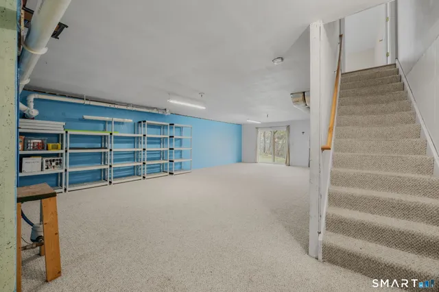 a view of water heater room with ceiling fan