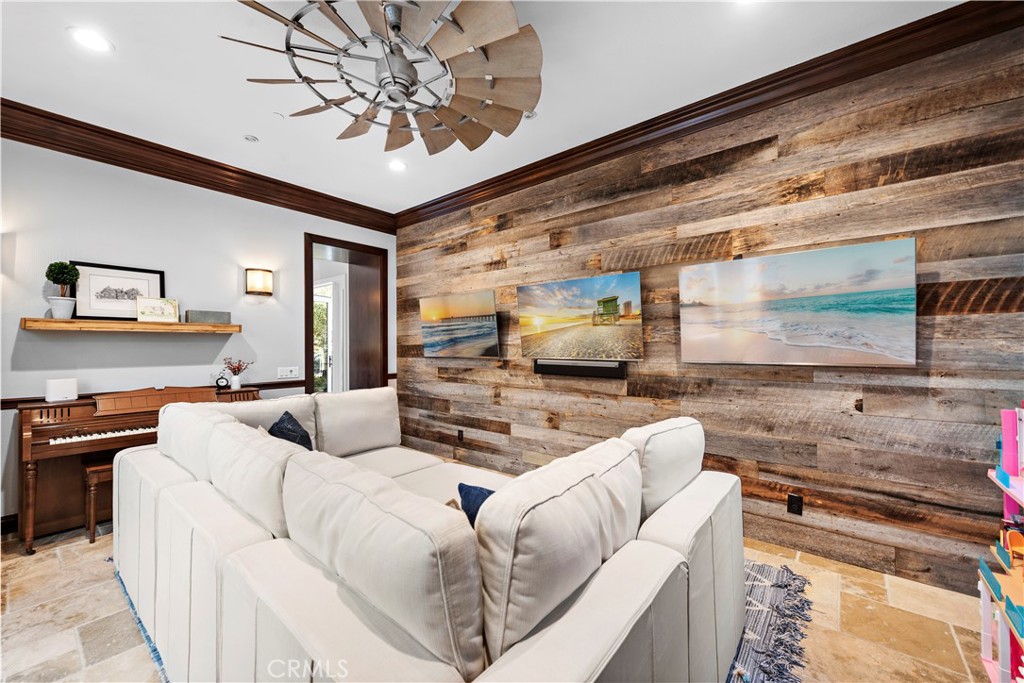 27 Pisano Street Ladera Ranch, CA 92694 - Photo 11 of 71 a living room with furniture and a flat screen tv