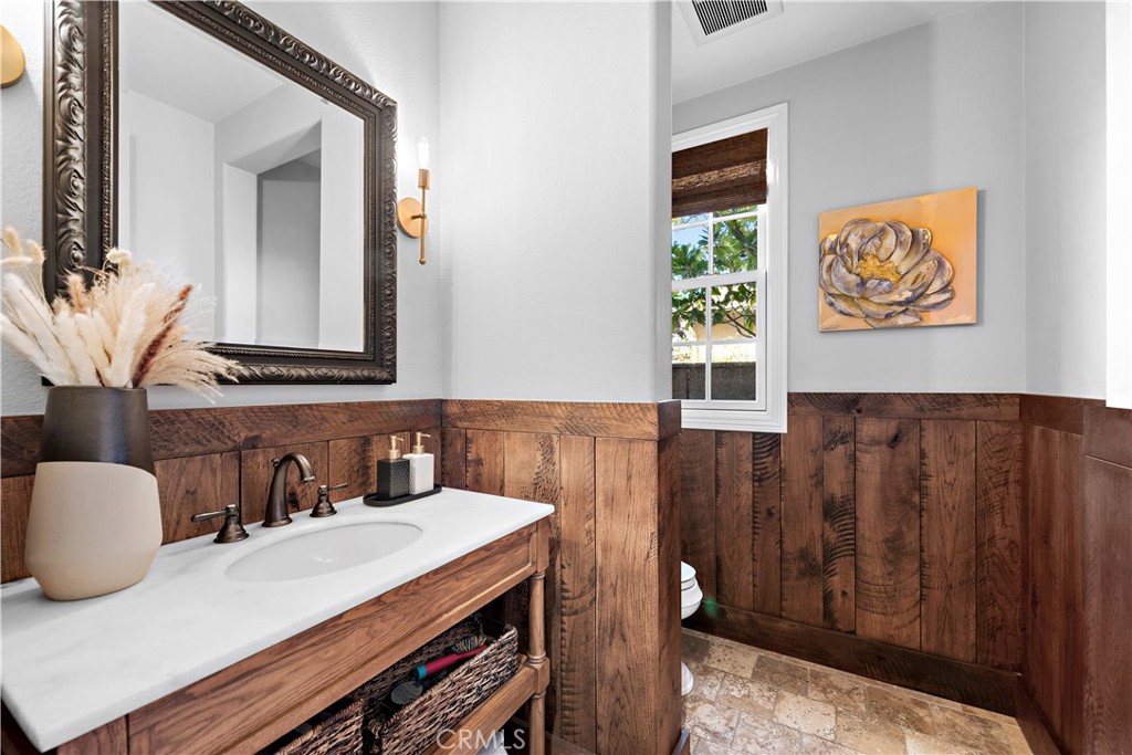 27 Pisano Street Ladera Ranch, CA 92694 - Photo 12 of 71 a bathroom with a sink a mirror and a vanity