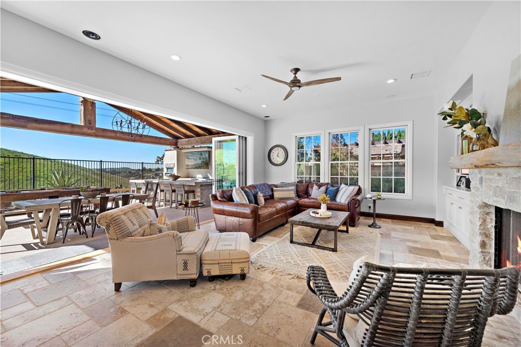 27 Pisano Street Ladera Ranch, CA 92694 - Photo 20 of 71 a living room with fireplace furniture and a large window