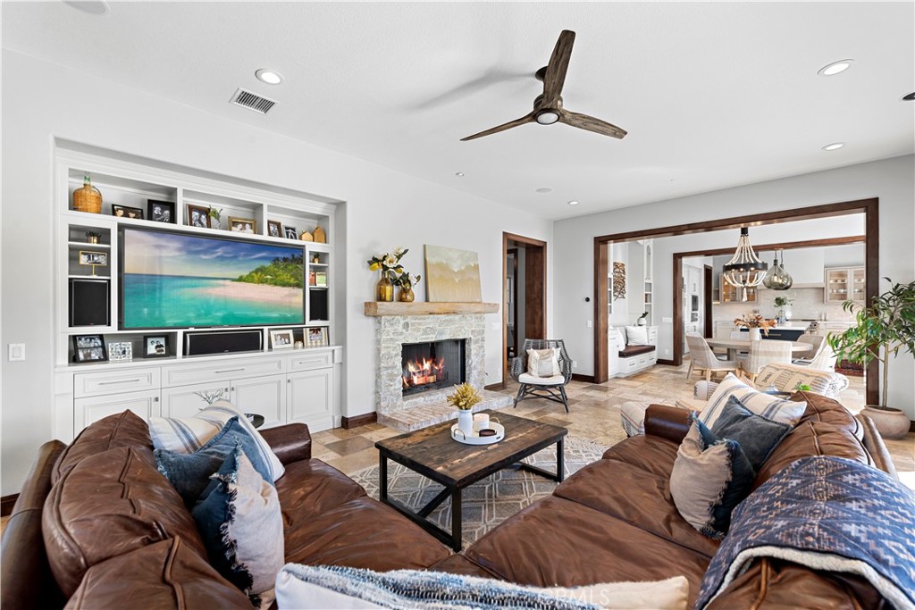 27 Pisano Street Ladera Ranch, CA 92694 - Photo 23 of 71 a living room with furniture large window and flat screen tv
