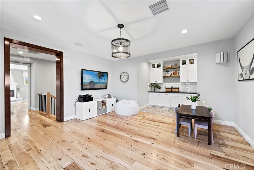 27 Pisano Street Ladera Ranch, CA 92694 - Photo 39 of 71 a bedroom with furniture and wooden floor
