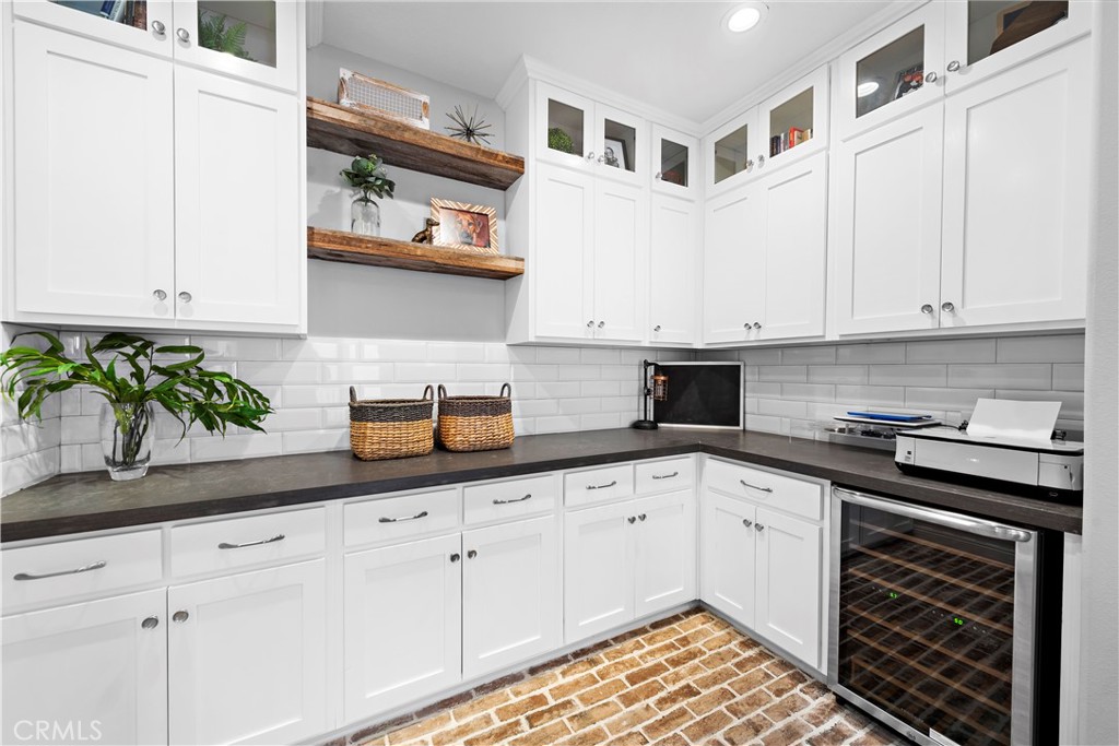 27 Pisano Street Ladera Ranch, CA 92694 - Photo 40 of 71 a kitchen with stainless steel appliances granite countertop a sink and cabinets