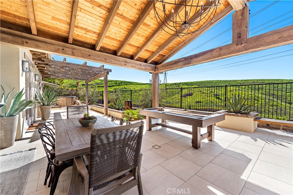 27 Pisano Street Ladera Ranch, CA 92694 - Photo 56 of 71 a view of a patio with a table and chairs